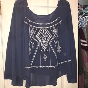 Navy blue long sleeve top with white print